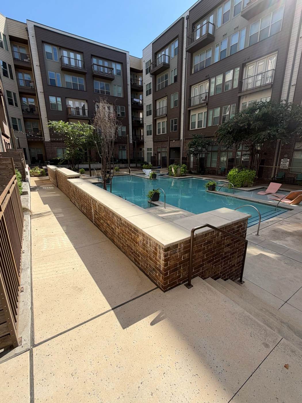 Pressure washed pool deck at a Fort Worth apartment complex
