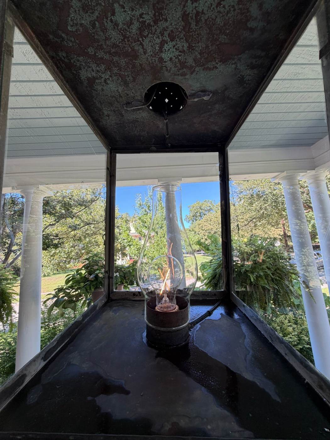 Same copper porch lantern after Blu's cleaned it